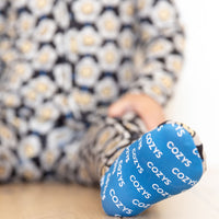 SMILEY GROOVY DAISY | FOOTIE ONE PIECE