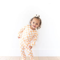 BRIGHT ORANGE + WHITE CHECKER | FOOTIE ONE PIECE