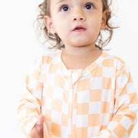 BRIGHT ORANGE + WHITE CHECKER | FOOTIE ONE PIECE