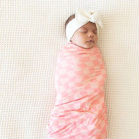 CORAL PINK WAVY CHECKER | SWADDLE