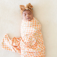ORANGE SMILEY CHECKER | SWADDLE