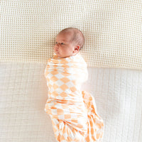 BRIGHT ORANGE + WHITE CHECKER | SWADDLE